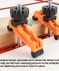 Close-up of Multi Position T Track Hold Down Clamp Kit for CNC Router with adjustable pivot knobs securing wood piece