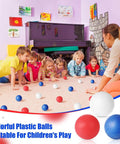 Children playing with 120 Pack Colored Table Tennis Balls 40 mm Plastic Balls Bulk for 4th of July Carnival Wedding Pool Games, DIY Arts, Pet Toys, School Patriotic Activities(Dark Blue, Red, White)
