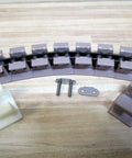 Tabletop Chain LF1863TABK2 0.25 Inch Pitch 11 Inch Long Industrial Conveyor Chain components on a light wood surface
