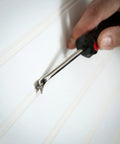 Heavy Duty Tack Lifter For Carpet Tacks And Small Nails With Chrome Vanadium Steel Shank and Rust Plating in use on skirting board