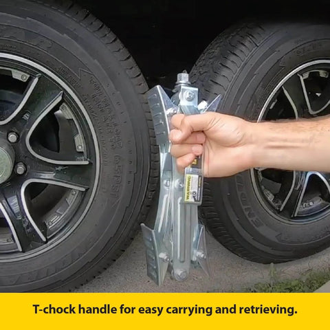 Heavy Duty Tandem Axle RV Wheel Chocks And Tire Stabilizers 2 Pack Keeps Campers Trailers Secure Fits Tires From 2 To 17 Inches Stromberg Carlson being held by a person beside two RV tires