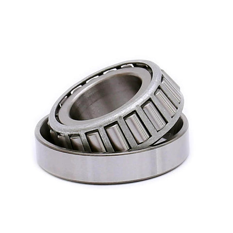 Close-up of Tapered Roller Bearing LM67048 LM67010, Set of 4 showcasing metal construction and roller design for automotive use.