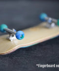 Apex 61D Urethane Fingerboard Wheels Globe Shape Terra Colorway installed on fingerboard, showing side view with ABEC-9 bearings.