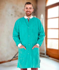 Teal Blue Disposable Lab Coats For Adults Pack Of 50 Knee Length 45 GSM With Cuffs Collar And 3 Pockets Plastic Snaps Front View