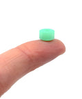 Apex 71D Urethane Fingerboard Wheels With New Street Style 7.7mm Diameter Ultra Spin Bearings Made In The USA UV Neon Teal on finger.