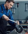 Technician using 1/2-13 Nuts and Bolts Assortment with 3/4 Inch Head Locking Nylon Nut for caster wheel installation in workshop
