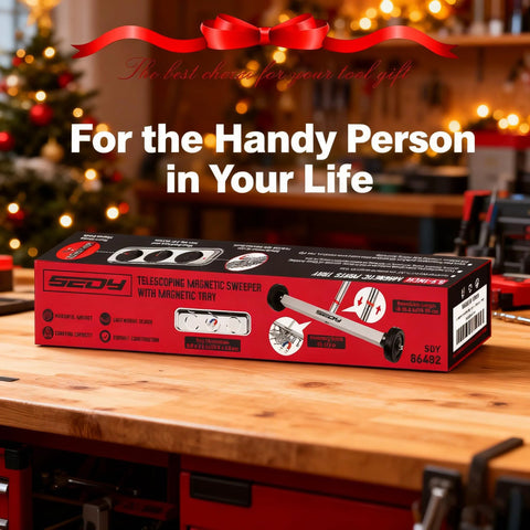 Effortless floor cleanup with a 17 inch heavy-duty magnet sweeper box on a workbench in holiday-themed garage.