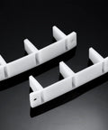Ten Piece Plastic Sliding Closet Door Floor Guide Set Bottom Track Mount Bypass For Wardrobe Doors Four And Three Sixteenth Inches White Durable Replacement Rails For Smooth Opening And Stable Alignment shown in a pair on a black background.