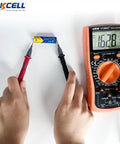 Hands using a multimeter to test AA And AAA Battery Combo Pack 80 Count 1.5V Carbon Zinc High Energy Batteries voltage.