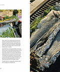 Texas Style Live Fire Grilling And Smoking At Home A Cookbook From The James Beard Award Winning Team Behind Franklin Smoke Wood Fire Food Packed With Pro Tips For Meats Veggies Fish And More open page showing grilled fish wrapped in foil with herbs