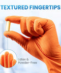 Close-up of orange nitrile glove holding a capsule, showing textured fingertips for grip. 8 Mil Nitrile Disposable Gloves Heavy Duty Mechanic Large 100 Count Powder Free.