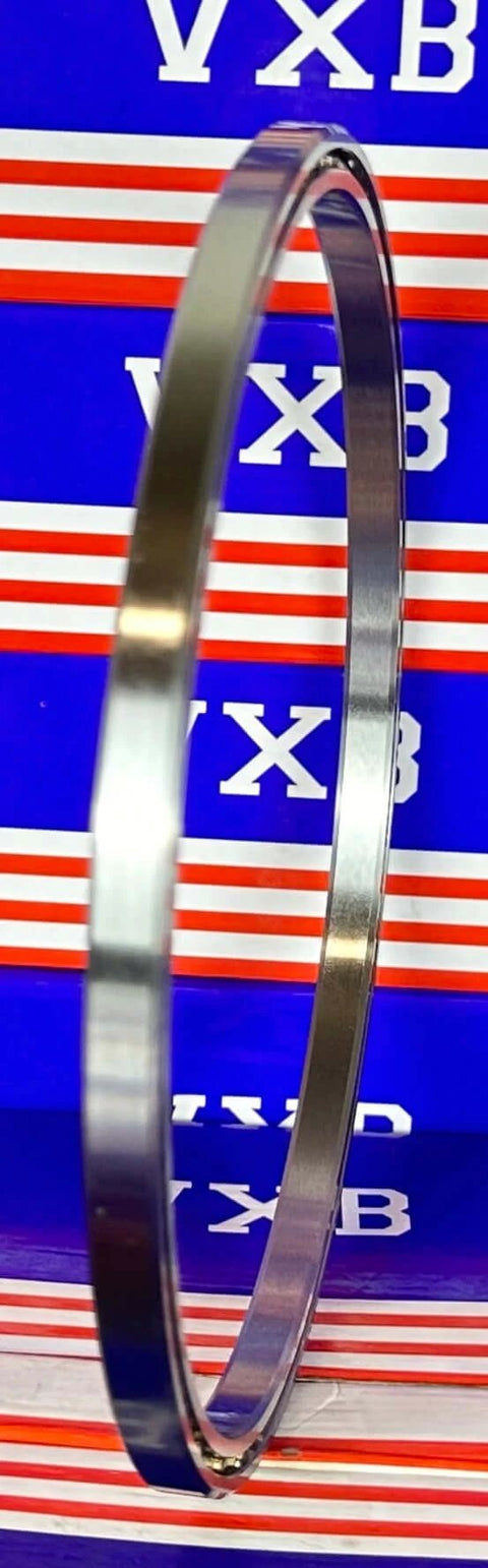 VB060CP0 Thin Section Ball Bearing 6" x 6-5/8" x 5/16" inch shown side view against colorful background.