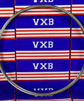 VA080CP0 Thin Section Bearing 8" x 8-1/2" x 1/4" inch chrome steel ring against VXB packaging.
