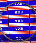 VA090CP0 Thin Section Bearing 9" x 9-1/2" x 1/4" inch shown against VXB product boxes.