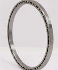 VB050CP0 Thin Section Bearing 5" x 5-5/8" x 5/16" inch side view showcasing chrome steel and brass cage design.