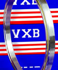 VC050CP0 Thin Section Bearing 5" x 5-3/4" x 3/8" inch side view of chrome steel bearing on blue background.