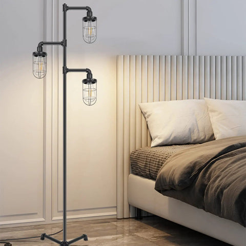 Three Head Steampunk Floor Lamp With Birdcage Shade Dope Industrial Rustic Edison Bulb Black Finish And Adjustable Cross Stand For Farmhouse Or Loft Living Room Decor By CONCA in a modern bedroom