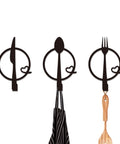 Three-Piece Knife, Fork and Spoon Kitchen Hook - Metal Wall Hanging with apron and spoon displayed on hooks