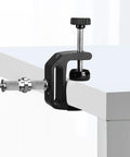 Three Piece Knurled One Quarter To Three Eighths Inch Metal Male Converter Screw Adapter attached to table edge