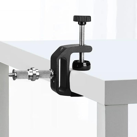 Three Piece Knurled One Quarter To Three Eighths Inch Metal Male Converter Screw Adapter attached to table edge