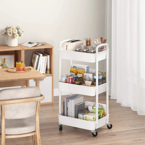 Three Tier Rolling Utility Cart With Handle For Office Kitchen And Living Room Grab And Go Moveable Storage Trolley On Wheels White Heavy Duty Plastic And Iron Frame Lockable Wheels Easy To Move And Organize in living room setting.