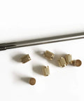 Throttle Shaft Bushing Repair Kit for Carburetors Five Sixteenth Shaft With Eight Brass Bushings and One Reamer on white background