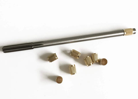 Throttle Shaft Bushing Repair Kit for Carburetors Five Sixteenth Shaft With Eight Brass Bushings and One Reamer on white background