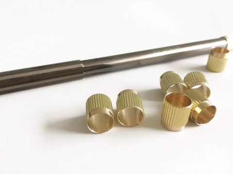 Pro Grade Throttle Shaft Bushing Repair Kit For Three Eighths Carbs, Includes Eight Brass Bushings And One Carbon Steel Reamer on white background