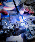 Close-up of ER308L Stainless Steel TIG Welding Rod 1/16 x 16 inches in use for welding metal with argon shield gas