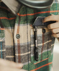 Person placing Professional TIG Welding Pen Holder With Metal Storage Case And Comfortable Grip into a plaid shirt pocket