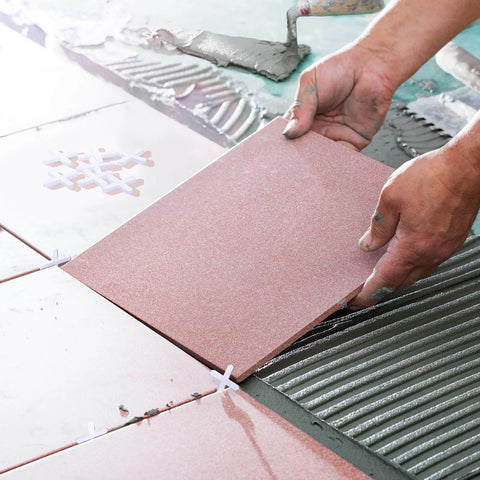 Installing tiles using 500 Piece Wide Tile Spacers And Levelers Set For Ceramic Tile And Stone Installation One Eighth Inch Thick Cross Spacers