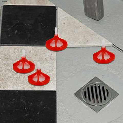 One Eighth Inch Tile Leveling System with red reusable caps installed on a tiled floor, showing spiral spacers in use.