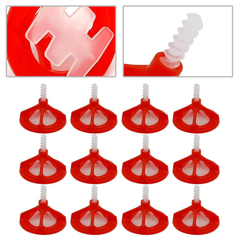 Close-up of red caps and spiral bases from a One Eighth Inch Tile Leveling System With Spiral Spacers And Red Reusable Caps Kit