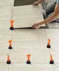 Tile Leveling System Kit With 100 Levelers, 500 Clips, 50 Wedges And 2 Wrenches used for installing floor tiles with consistent gaps