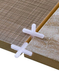 500 Piece Wide Tile Spacers And Levelers Set For Ceramic Tile And Stone Installation, cross spacers in use between tiles