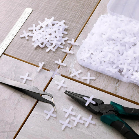 500 Piece Wide Tile Spacers And Levelers Set For Ceramic Tile And Stone Installation One Eighth Inch Thick in use on tiles