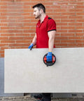 Man using Battery Powered Tile Vacuum Suction Cup Tool for handling large ceramic tile, 220 mm grip, 140 kg capacity