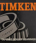 Timken tapered roller bearings packaging with illustrated bearings on black background