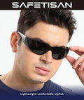Man wearing Tinted Safety Glasses Bulk 24 Pack With UV Protection Dark Smoke Lenses