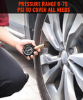 Tire Pressure Gauge 0-75 PSI With Large Glow Dial Calibrated To ANSI B40.1 checking car tire in a garage setting