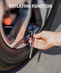 Pencil Tire Pressure Gauge 2 Pack With 16 Tire Caps Calibrated To ANSI B40.1 being used to deflate a car tire.