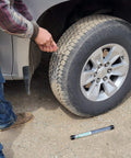 Person using Tire Repair Kit Bundle With Knife Included And Insertion Tool, fixing flat tire on vehicle