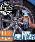 Person holding Tire Kicker Sprayable Extra Glossy Tire Shine Spray Dry To Touch Dressing Restores Wet Look To Rubber Vinyl And Plastic