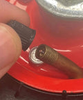 Close-up of a tire valve stem being capped, on a 4 Pack 6 Inch Swivel Pneumatic Air Caster Wheels With Knobby Tread For Industrial Carts.
