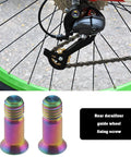 ECSiNG 2pcs Titanium Alloy Fixing Screws Bicycle Rear Derailleur Bolt Bicycle Derailleur Guide Wheel Fixing, shown near bike wheel