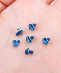 SaiDian 6Pcs Titanium Blue Screw Set Knife Handle Screws for Microtech UTX-85 Matrix shown close-up on a hand.