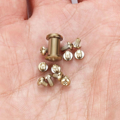 HiSpkNix Titanium Screw Set for Benchmade 535 Bugout, 533 Mini Bugout & 537 Bailout - Gold screws in hand