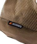 Close-up of Titanium Turbo Blanket For T25 And T28 Turbos With Volcanic Lava Rock Outer Layer, showing texture and logo tag.