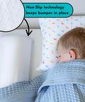 Child sleeping with Soft Foam Toddler Bed Bumper Guard With Non Slip Cover Safe Sleep Bed Rail Alternative visible on bed