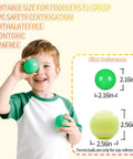Child holding green ball from Green Ball Pit Balls - Crush Proof Plastic Balls for Ball Pit Pack of 100pcs Set for Toddlers